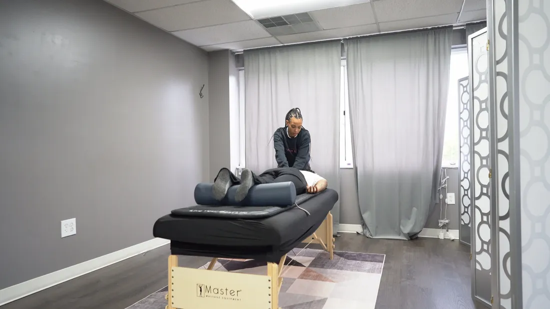 A treatment room at The Stretch Loft, a client resting on the stretch table